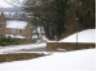 lots of snow in foreground houses in background